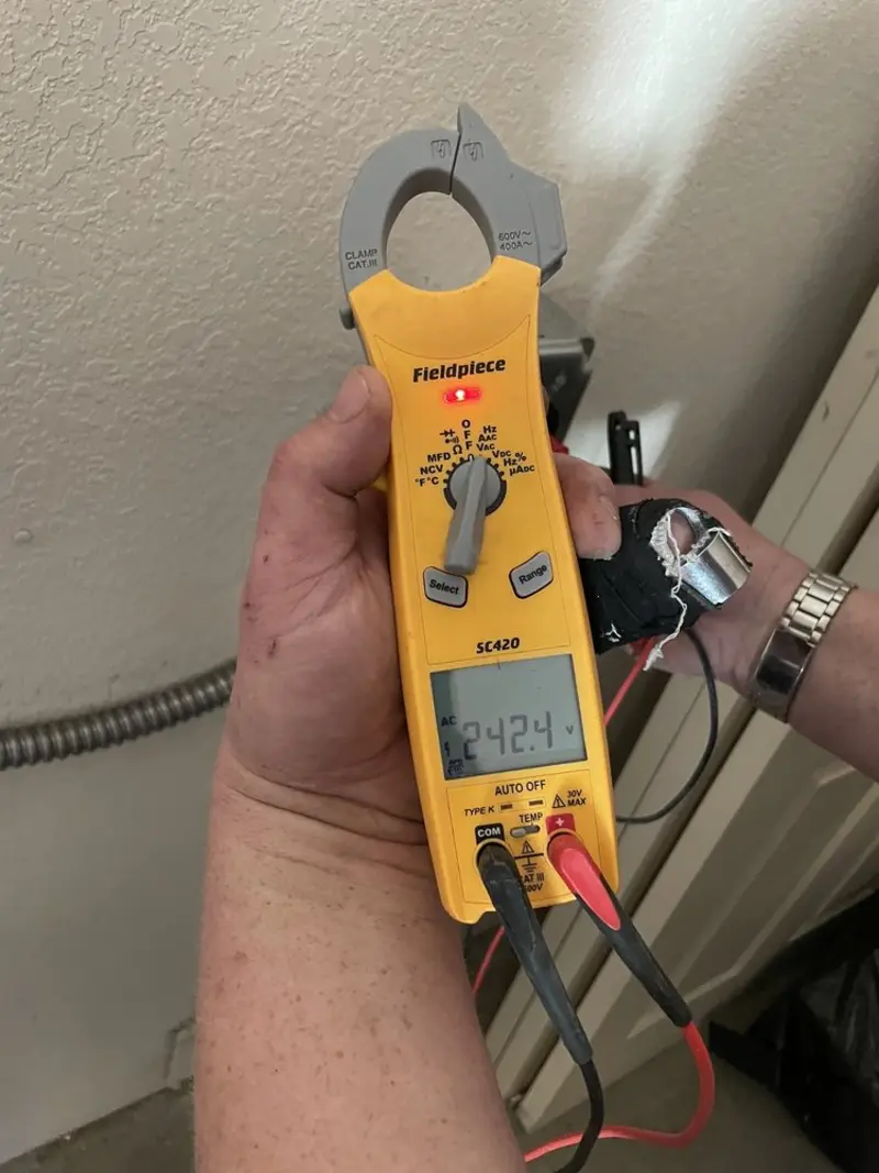 Voltage testing with clamp meter during Outlet Installation in Grayslake